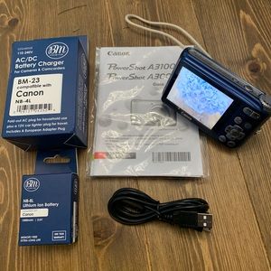 Brilliant Blue Canon PowerShot A3100 IS Digital Camera in working condition.